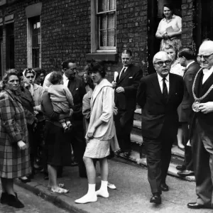 Dr Charles Hill, Minister of Housing, making a tour of China Street, Everton