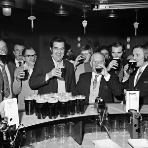 A drinkers dream - man with twenty pints in the pub. 1st January 1973