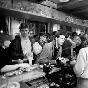 Drinkers in an East End Pub enjoying a pint of beer. March 1987