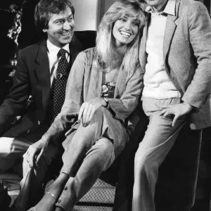 Dudley Moore and Susan Anton laughing during filming interview on Print