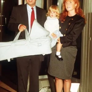 Duke And Duchess Of York with their Children Beatrice and Eugenie in her Carry-Cot Duke And Duchess Of York with their Children Beatrice and Eugenie in her Carry-Cot