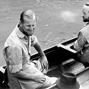 The Duke of Edinburgh and Lieutenant-Commander Parker in a canoe during his visit to