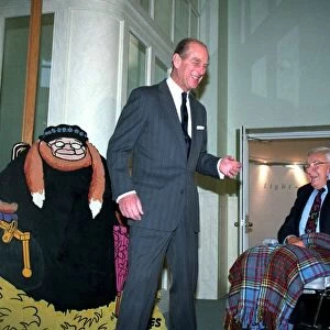 The Duke of Edinburgh, Prince Philip with Cartoonist Carl Giles at exhibition of
