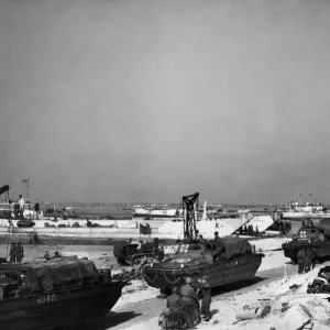 DUWKS lined up on the beach after discharging their loads. 9th June 1944 DUWKS lined up on the beach after discharging their loads. 9th June 1944