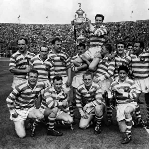 E. Asthon, Wigan captain holds the cup aloft, when he was being chaired by his colleagues