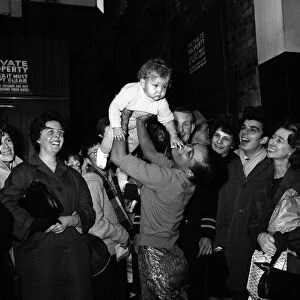 Eartha Kitt with her baby daughter Kitt meeting fans outside the stage door after a dress