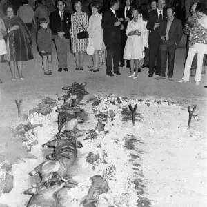 Eating Out, Majorca, Spain, August 1971. Pigs being roasted on spit Eating Out, Majorca, Spain, August 1971. Pigs being roasted on spit