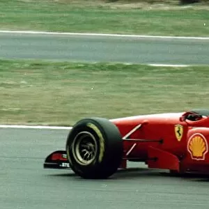 Eddie Irvine retires from the British Grand Prix after the engine of his Ferrari blew up