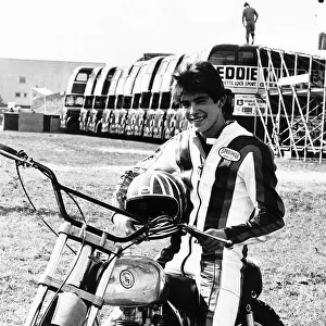 Eddie Kidd on his motorcycle infront of a line of buses he is about to attempt to jump