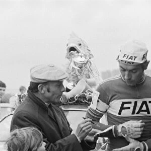 Eddy Merckx is asked to sign his autograph for a fan, as he attends Britains biggest