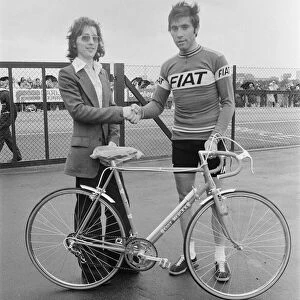 Eddy Merckx (right) presents n Eddy Merckx cycle to Daily Mirror competition winner