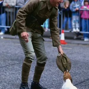 Edinburgh Festival August 1989 Dog chewing soldiers cap holding cigarette