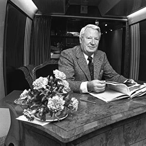 Edward Heath onboard a train at Moor Street Station signing copies of his latest books