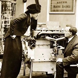 An Edwardian lady listen to an explanation of how the Aster marine Engine works at