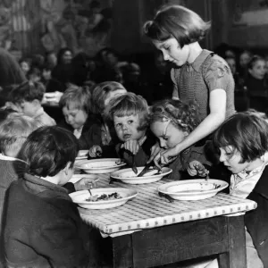 Eileen Meakin, aged 13, with some of her little charges at a Hoxton Children Eileen Meakin, aged 13, with some of her little charges at a Hoxton Children
