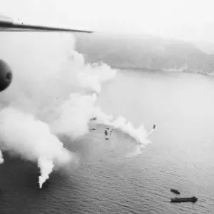 Print of Allied landing craft approaching the island