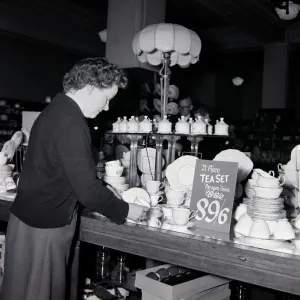 An elderly lady looking for bargains during january sales at Derry