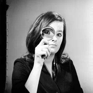 Elementary my dear Watson. Woman holding magnifying glass. Model: Jennie Cropper Elementary my dear Watson. Woman holding magnifying glass. Model: Jennie Cropper