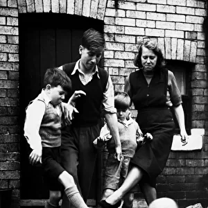 Elizabeth Charlton playing a game of football with her three sons Gordon aged 10