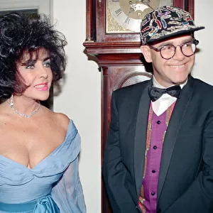 Elizabeth Taylor and Elton John at a gala dinner in aid of the AIDS Crisis Trust in