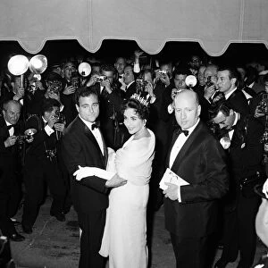 Elizabeth Taylor and husband, film producer Mike Todd, pictured on opening night of