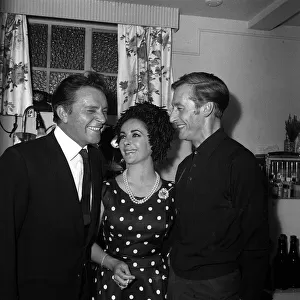 Elizabeth Taylor with husband Richard Burton and John Neville at the Duchess Theatre in