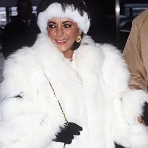 Elizabeth Taylor Jan 1987 wearing White Fur coat at Heathrow Airport