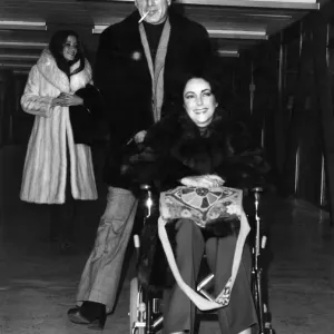 Elizabeth Taylor and Richard Burton Pictured at Heathrow Airport. December 1975 Elizabeth Taylor and Richard Burton Pictured at Heathrow Airport. December 1975