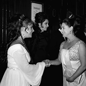 Elizabeth Taylor shaking hands with Princess Margaret at premiere of