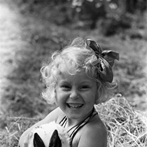 Ella Edwards holding a rabbit. August 1941