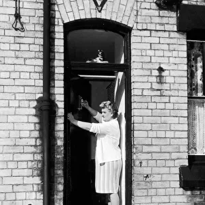 Elsie Starkey, mother of Ringo Starr, July 1964. Pictured polishing door knocker at No
