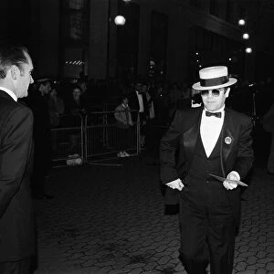 Elton John arriving at the premiere of "The Last Starfighter"in London