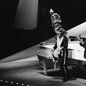 Elton John in concert during his Ice on Fire Tour, pictured performing at Wembley Arena