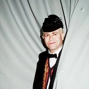 Elton John concert Palais de Sports Paris cap bow tie standing in curtain