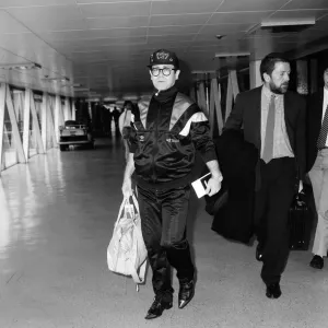 Elton John at Heathrow Airport, London. 19th September 1987 Elton John at Heathrow Airport, London. 19th September 1987