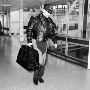 Elton John at Heathrow Airport, London. 25th September 1987 Elton John at Heathrow Airport, London. 25th September 1987