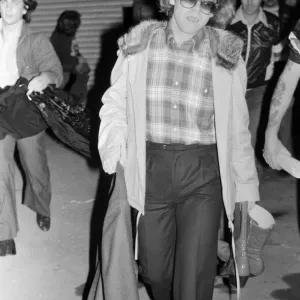 Elton John leaving the Empire Pool Wembley by the back door after he announced his