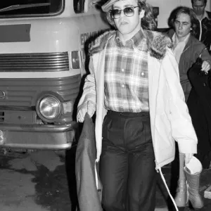 Elton John leaving the Empire Pool Wembley by the back door after he announced his
