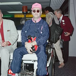 Elton John at London Heathrow Airport. 18th July 1990