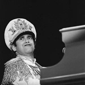 Elton John performing in concert during his "Jump Up Tour". 5th December 1982
