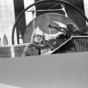 Elton John performing on stage at Wembley Stadium. London