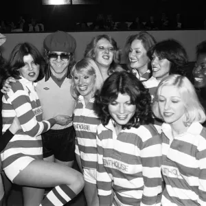 Elton John with Bunny Girls and Penthouse Pets at Empire Pool, 1977 Print