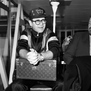 Elton John pictured at London Airport. 19th June 1987 Elton John pictured at London Airport. 19th June 1987