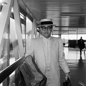 Elton John pictured at London Airport. 21st January 1984