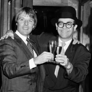 Elton John presents Watford FCs new manager, Dave Bassett, at a London reception