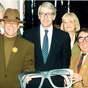 Elton John singer John Major and Ronnie Corbett help launch an appeal for old specs to be