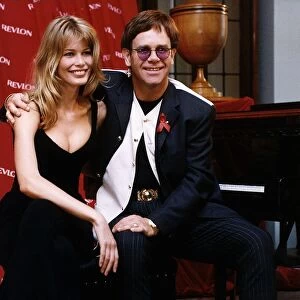 Elton John singer with model Claudia Schiffer