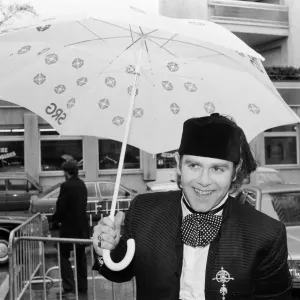 Elton John standing in the rain. He is in Montreux to perform at the Montreux Pop Elton John standing in the rain. He is in Montreux to perform at the Montreux Pop