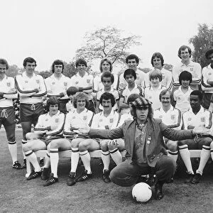 Elton John superstar and members of the England football team pose with schoolchildren in