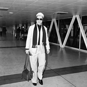 Elton John on his way to New York from Londons Heathrow Airport. 8th October 1978